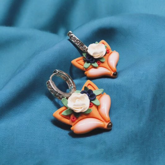 Volpine con la rosa bianca